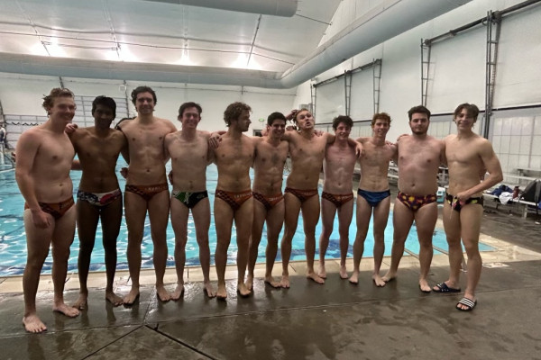 UVA men's water polo club team standing on pool deck